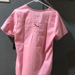 Koi scrubs. Top size small (tag still on) Pants size medium. Worn 1 time.